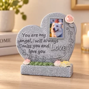 Angel Heart pet memorial plaque, gray heart-shaped plaque with pink rose accent and sample dog portrait, angled product view