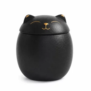 Small 150 ml black ceramic cat urn on white background
