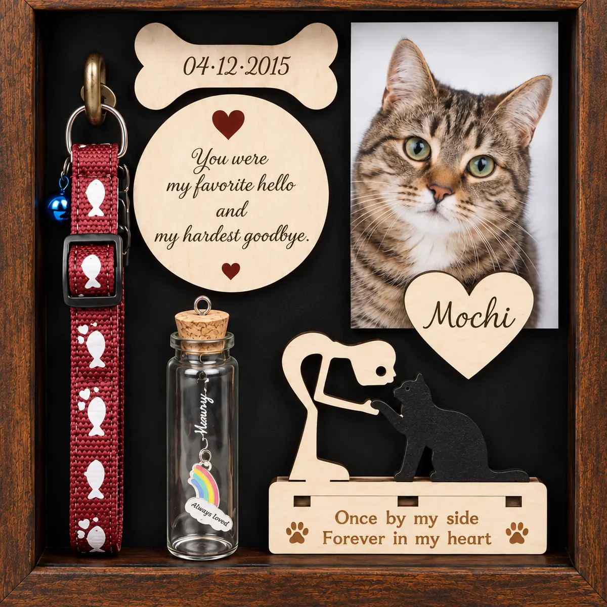 Close view of cat memorial shadow box portrait, keepsake bottle and cat silhouette