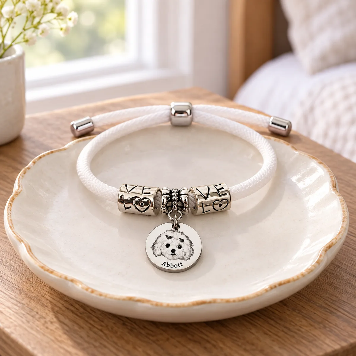 Personalized Pet Portrait Cord Bracelet with Engraving, on a jewelry tray
