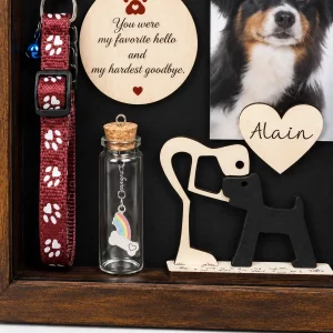 Close view of dog memorial shadow box keepsake bottle, sample collar and silhouette ornament