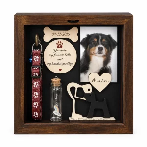 Dog memorial shadow box frame with dog photo, collar and keepsakes on a white background