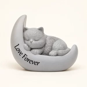 Sleeping cat memorial urn inside pale crescent moon on ivory background