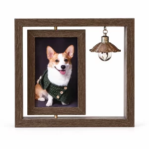 Dark wood-look pet memorial photo frame with sample dog portrait and hanging bulb ornament