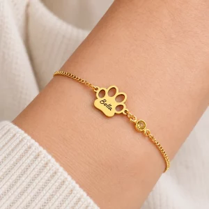 Personalized Paw Name Bracelet with Birthstone Charms, worn on an adult