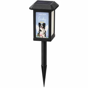 Photo-panel solar pet memorial garden light with example dog portrait on a white background