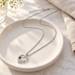 Sterling Silver Heart and Infinity Paw Print Necklace, on a jewelry tray