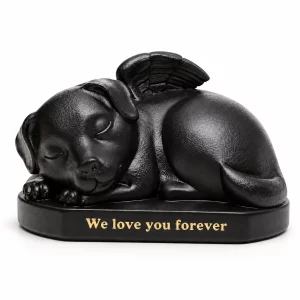 Black curled sleeping dog urn with angel wing, oval base and gold text