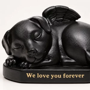 Close view of sleeping dog angel urn with peaceful face and We love you forever inscription