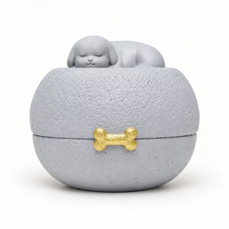 Gray sleeping dog pet urn with a small gold bone accent on the front