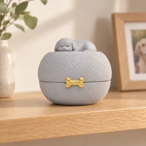 Sleeping dog pet urn displayed on an indoor oak remembrance shelf